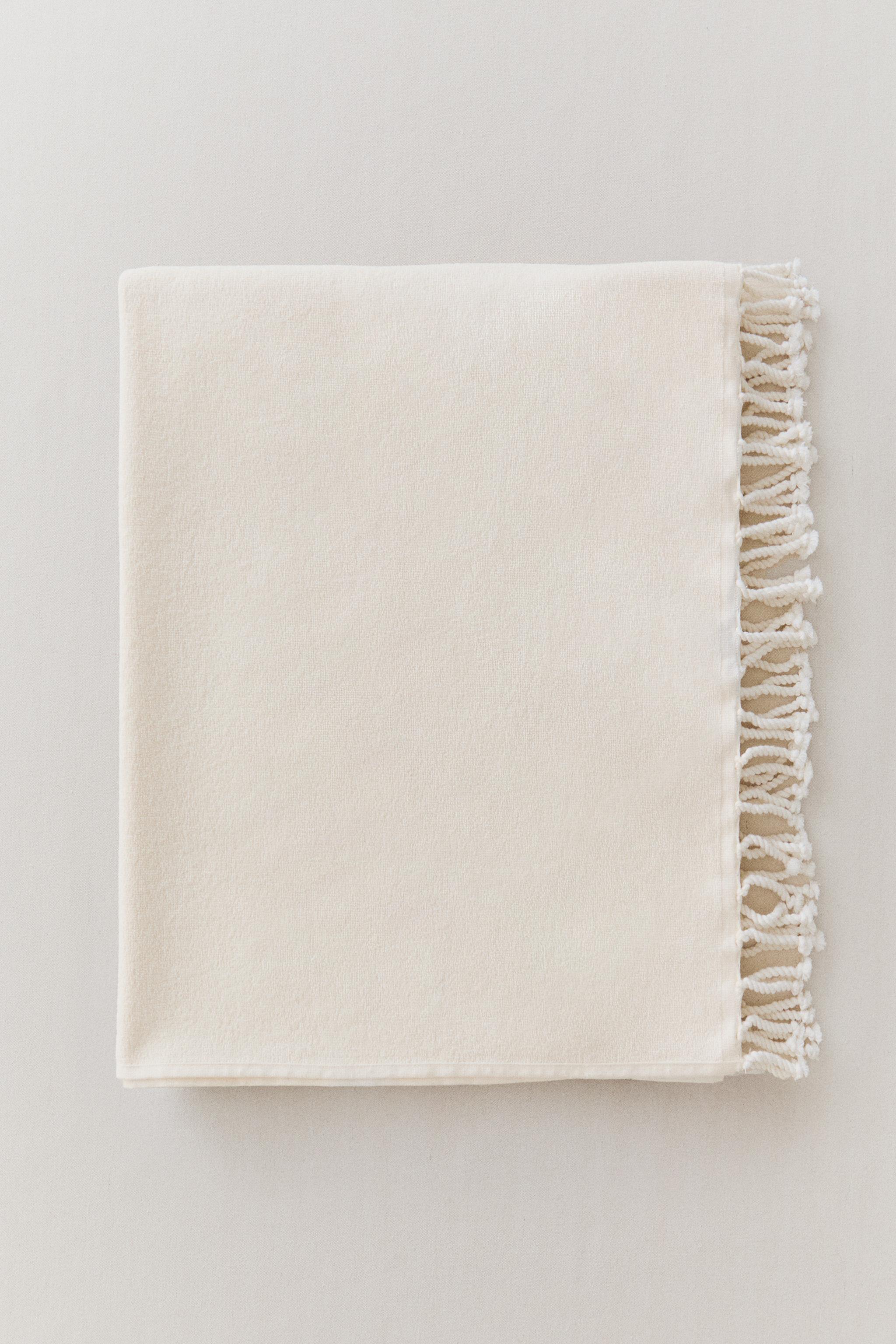 COTTON BEACH TOWEL WITH FRINGE